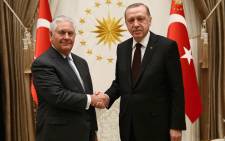 In this handout photograph taken and released by The Turkish Presidential Press Office on 15 February, 2018, Turkish President Recep Tayyip Erdogan shakes hands with US Secretary of State Rex Tillerson ahead of a meeting at the Presidential Complex in Ankara. Picture: AFP.