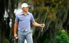 Jordan Spieth waves to the gallery on the 18th green after his 10-stroke victory at the Hero World Challenge on 7 December 2014. Picture: AFP.