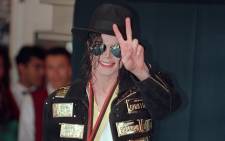 FILE: US pop star and entertainer Michael Jackson flashes the victory sign after receiving the lifetime achievement medal from the Guinness book of records in Hollywood on 19 May 1993. Picture: AFP
