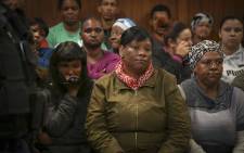 FILE: The mother of three-year-old Courtney Pieters (left) sits in Goodwood Magistrates Court where her daughter's alleged murderer appeared. Picture: Cindy Archillies/EWN