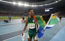 South Africa’s Wayde van Niekerk celebrates winning the Men’s 400m Final during the athletics event at the Rio 2016 Olympic Games at the Olympic Stadium in Rio de Janeiro on 14 August, 2016. Picture: AFP.