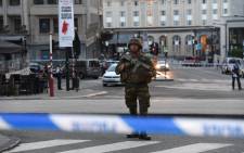 A soldier stands alert in a cordoned off area outside Gare Central in Brussels on June 20, 2017, after an explosion in the Belgian capital. Picture: AFP