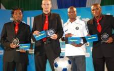 FILE: The Mpumalanga Black Aces striker (L) shows an award he won while playing for Ajax Cape Town.