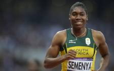 Caster Semenya smiles after the women’s 800m final at the athletics event of the London 2012 Olympic Games on 11 August, 2012 in London. Picture: AFP.