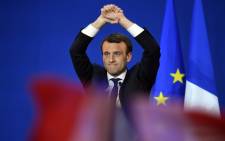 French presidential election candidate for the En Marche ! movement Emmanuel Macron gestures at the audience during a meeting at the Parc des Expositions in Paris, on 23 April, 2017, after the first round of the Presidential election. Picture: AFP