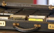 A case of cassette tapes that belonged to Britain's Diana, Princess of Wales, containing albums by singers Diana Ross, Elton John and George Michael, is pictured at Buckingham Palace in London on 20 July 2017. Picture: AFP