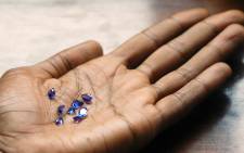 This file photo taken in 2006 shows tanzanite gems worth $1,500 from the Mererani mine in Tanzania. Picture: AFP.