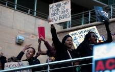 Demonstrators gather near the Johannesburg Stock Exchange in Sandton on 13 September 2019 in protest against gender-based violence. Picture: Kayleen Morgan/EWN
