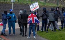 Pro-Union Loyalists demonstrate against the Northern Ireland Protocol implemented following Brexit, on the road leading to the Port of Larne in County Antrim, Northern Ireland on 6 April 2021. Picture: PAUL FAITH/AFP