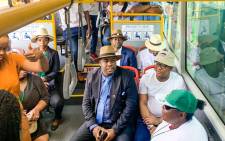 Transport Minister Fikile Mbalula (in brown bucket hat and white T-shirt) uses a bus to showcase Tshwane's integrated transport systems on 25 October 2019. Picture: @MbalulaFikile/Twitter