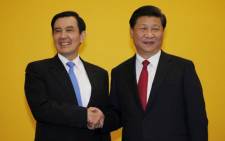 Chinese President Xi Jinping shakes hands with Taiwan's President Ma Ying-jeou during a summit in Singapore on 7 November 2015. Picture: Twitter