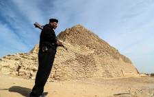 A policeman stands guard near the step pyramid of Djoser in Egypt's Saqqara necropolis, south of the capital Cairo, on March 5, 2020. Picture: AFP.