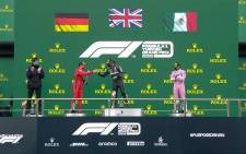Mercedes' British driver Lewis Hamilton (centre) celebrates on the podium after winning the Turkish Formula One Grand Prix at the Intercity Istanbul Park circuit in Istanbul on 15 November 2020. Picture: @F1/Twitter 