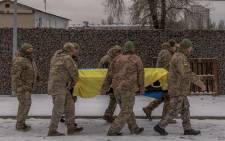 Ukrainian soldiers carry the coffin of Ukrainian serviceman Sergiy Pavlichenko, who was killed fighting Russian troops in the Zaporizhzhia region, during a funeral service at a cemetery in Kyiv, on November 29, 2023, amid the Russian invasion of Ukraine. Picture: Roman PILIPEY / AFP.