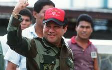 This file photo taken on October 04, 1989 shows former Panamanian strongman General Manuel Noriega waving as he leaves his headquarters in Panama City following a failed coup against him. Picture: AFP