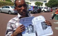 Jonathan Adams hands out posters of the two missing Belhar boys on 10 January 2014. Picture: Lauren Isaacs/EWN