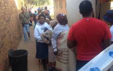 People arrive at the Tshupane primary school polling station in Tlokwe to vote. Picture: Govan Whittles/EWN