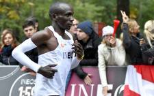 Kenya's Eliud Kipchoge (white jersey) runs during his attempt to bust the mythical two-hour barrier for the marathon on 12 October 2019 in Vienna. He tried in May 2017 to break the two-hour barrier, running on the Monza National Autodrome racing circuit in Italy, failing narrowly in 2hr 00min 25sec. Picture: AFP