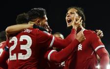 Liverpool’s Virgil van Dijk celebrates with teammates after scoring a goal against city rivals Everton. Picture: @LFC/Twitter.