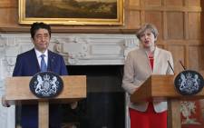 Britain's Prime Minister Theresa May delivers a statement alongside Japan's Prime Minister Shinzo Abe at Chequers, the prime minister's official country residence, near Ellesborough, northwest of London, on 28 April, 2017. Picture: AFP.