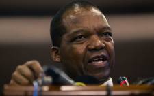 Zimbabwe Reserve Bank Governor John Mangudya delivers his Monetary Policy Statement in Harare on 20 February 2019, where he announced the establishment of an interbank foreign exchange market in the country officially abandoning the 1:1 exchange rate between the USD and the country's quasi-currency bond note. Picture: AFP