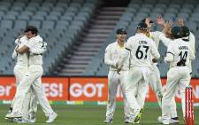 Australian players celebrate victory against England in the second cricket Test match of the Ashes series at Adelaide Oval on December 20, 2021, in Adelaide. Picture: William West / AFP.