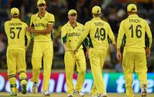 The Australian team leaves the ground after defeating Afghanistan in the 2015 Cricket World Cup Pool A match in Perth on 4 March, 2015. Picture: AFP