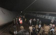 Two express trains were partially swept off a flooded bridge over a river in central India, killing at least 20 people and injuring 100. Picture: Handout via Reuters.