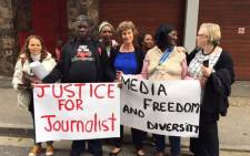 Activists and journalists standing outside the Labour Court in Cape Town after Former Cape Times Editor Alide Dasnois reached a settlement with the Independent Media Group following a three-year legal tussle on 9 May 2016. Picture: Natalie Malgas/EWN.