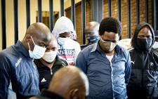 Five suspects - Khulela Themba Sibiya, Bongani Sandiso Ntanzi, Mthobisi Chris Mncube, Mthokoziseni Zifozonke Mapisa and Sifiso Ntuli - appeared at the Boksburg Magistrates Court on 27 October 2020. They are charged with the 2014 murder of Bafana Bafana and Orlando Pirates captain Senzo Meyiwa. The suspects refused to stand in the dock, saying they were innocent and would not answer for a crime they did not commit. Picture: Xanderleigh Dookey/EWN.