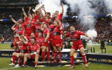 The Toulon team celebrate with the trophy after winning 24-18 during the European Rugby Champions Cup rugby union final match between Clermont and Toulon at Twickenham Stadium, south west of London on 2 May, 2015. Picture: AFP