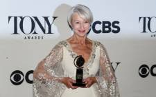 Helen Mirren poses backstage with her award for best performance by an actress in a leading role in a play for 'The Audience' during the American Theatre Wings 69th Annual Tony Awards at the Radio City Music Hall in New York City on June 7, 2015. Picture: AFP.