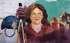 Palestinian artists paint a mural in honour of slain veteran Al-Jazeera journalist Shireen Abu Akleh in Gaza City on 12 May 2022. Abu Akleh, who was shot dead on May 11, 2022 while covering a raid in the Israeli-occupied West Bank, was among Arab media's most prominent figures and widely hailed for her bravery and professionalism.