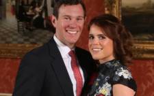 FILE: Britain's Princess Eugenie of York poses with her fiancé Jack Brooksbank at Buckingham Palace in London on 22 January 2018 after the announcement of their engagement. Picture: Jonathan Brady/POOL/AFP