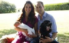 Prince William and his wife Catherine, with their newborn baby boy, Prince George of Cambridge, Tilly the retriever (L), a Middleton family pet and Lupo, the couple's cocker spaniel (R) at the Middleton family home in Bucklebury, Berkshire, in early August, 2013. Picture: AFP.