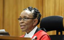 Judge Thokozile Masipa reads her judgement during sentencing of Oscar Pistorius at the High Court in Pretoria on 21 October 2014. Picture: Pool.