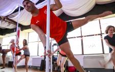EWN sports reporter Marc Lewis feels the burn during a pole dancing class. Picture: Thomas Holder/EWN