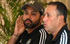 India's chief cricket selector Ajit Agarkar (R) and team captain Rohit Sharma attend a press conference in Kandy on 5 September 2023. First-choice wicketkeeper KL Rahul was named in India's squad on 5 September for the one-day World Cup on home soil after missing several months through injury. Picture: Ishara S. KODIKARA/AFP
