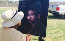 A local artist painting a portrait of Nkululeko 'Flabba' Habedi on the day of his funeral says he will give it to the rapper’s mother. 15 March 2015. Picture: Dineo Bendile/ EWN
