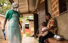 A woman and her child, both infected with monkeypox await treatment at the quarantine area of the centre of the International medical NGO Doctors Without Borders in Zomea Kaka in the Central African Republic on 18 October 2018.