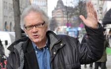 In this file photo taken on 11 March 2010 Swedish cartoonist Lars Vilks walks in the streets of Stockholm. Swedish cartoonist Lars Vilks, who lived under police protection after his 2007 depiction of the Prophet Mohammed prompted death threats, died 3 October 2021 in a car accident. Picture: FRANCOIS CAMPREDON/AFP