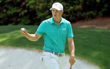 Jordan Spieth of the United States holds up his ball after putting for birdie on the 13th green during the first round of the 2016 Masters Tournament at Augusta National Golf Club on 7 April, 2016 in Augusta, Georgia. Picture: AFP.