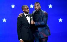 FILE: Kris Bowers (L) listens while winner Mahershala Ali accepts the Best Supporting Actor award for 'Green Book' onstage during the 24th annual Critics' Choice Awards at Barker Hangar on 13 January 2019. Picture: AFP