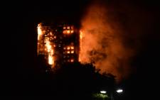 This handout image received by local resident Giulio Thuburn early on June 14, 2017 shows flames engulfing a 27-storey block of flats in west London. Picture: AFP