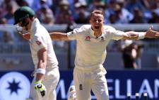 England's Tom Curran (R) celebrates bowling Australia's batsman Steve Smith (L) on the second day of the fourth Ashes cricket Test match at the MCG in Melbourne on 27 December, 2017.  Picture: AFP