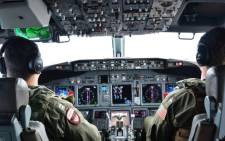FILE: Naval aviators during a mission to assist in search and rescue operations for Malaysia Airlines flight MH370 on 24 March 2014. Picture: AFP.