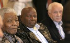 The late Alf Kumalo (centre) with former president Nelson Mandela.