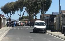 Police at Begonia Street in Mitchells Plain where a murder-suicide took place involving a Cape Town police officer. Picture: Shamiela Fisher/EWN