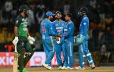 India's Kuldeep Yadav (2R) celebrates with teammates after taking the wicket of Pakistan's Fakhar Zaman (L) during the Asia Cup 2023 super four one-day international (ODI) cricket match between India and Pakistan at the R. Premadasa Stadium in Colombo on 11 September 2023. Picture: FAROOQ NAEEM/AFP
