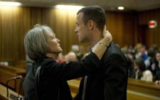 Oscar Pistorius with a family member at the High Court in Pretoria on 7 April 2014. Picture: Pool.